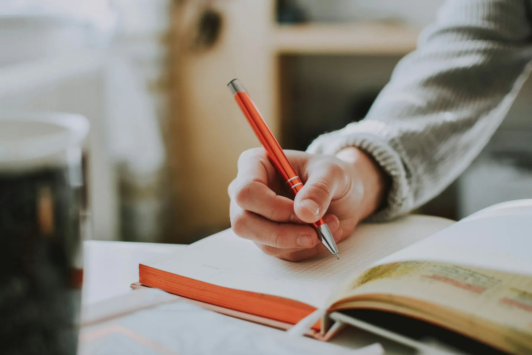 Writing notes in a book
